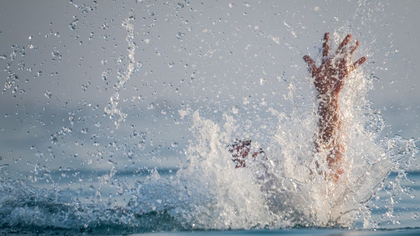 An illustration of a hand reaching above the water, from Julee’s rafting story